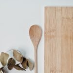 brown wooden spoon on white surface