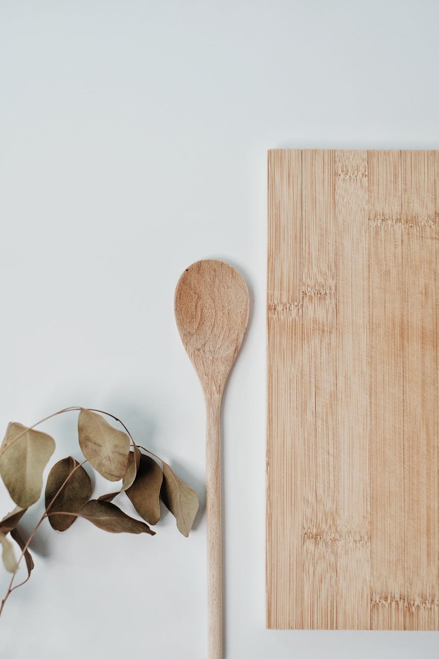 brown wooden spoon on white surface